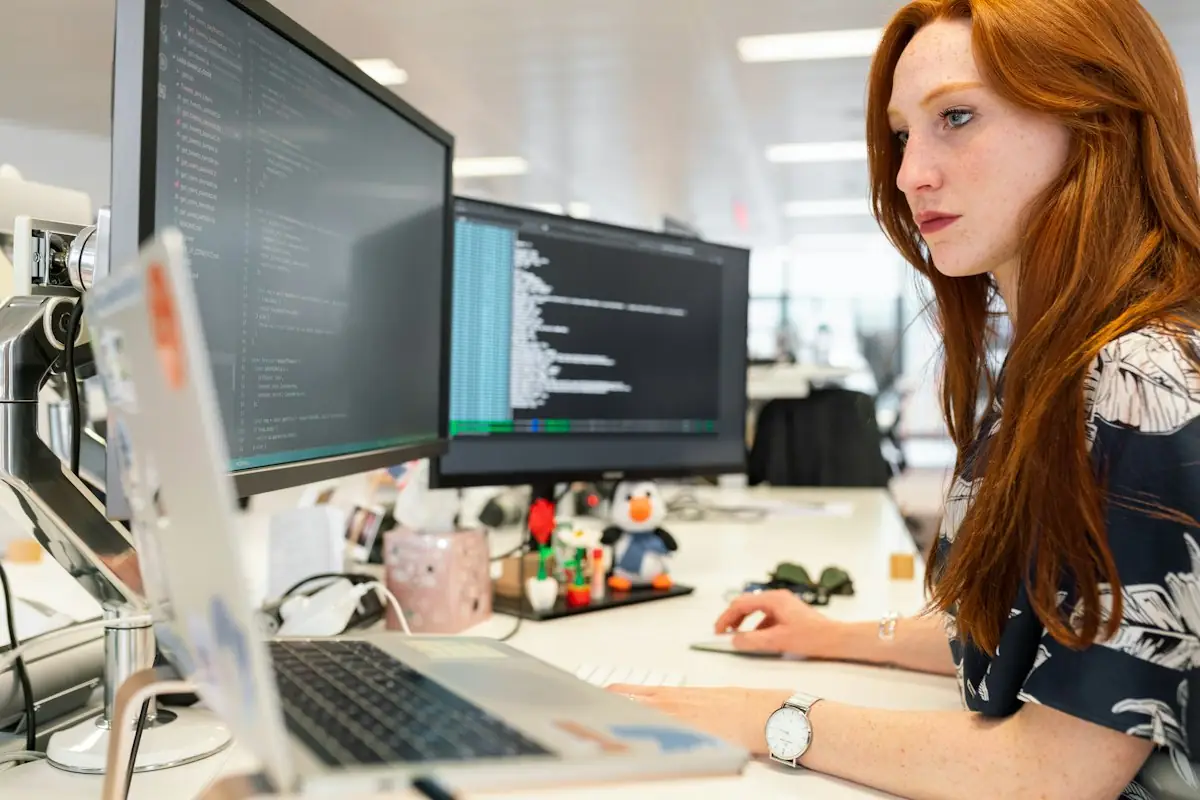 Developer working across several screens